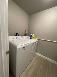 a laundry room with a washer and dryer at Federal Palace in Saskatoon +37 photos