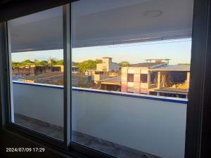 a view of a city from a window at Hotel Perla Dorada in San Miguel