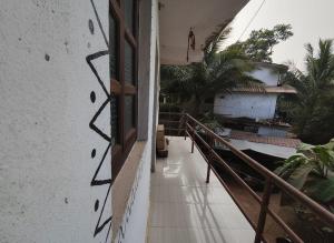 an empty balcony of a building with a window at House 21 - Mid in Querim