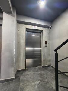 a elevator in a building with a metal door at Downtown Historic Area Modern and Comfortable in Puebla