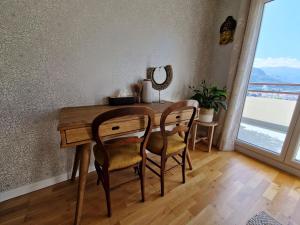 a dining room with a table and two chairs at Omah Jawa in Lourdes +17 photos