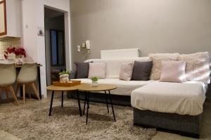 a living room with a couch and a table at Home Irianna in Marathon +58 photos
