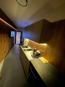 a kitchen with a sink and a counter top at Studio Luxe in Kampor