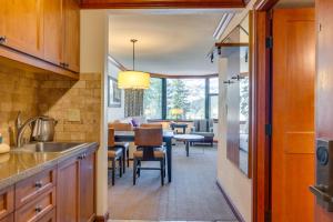 a kitchen and living room with a dining room at Everline Resort Suite: North Lake Tahoe Luxury! in Olympic Valley