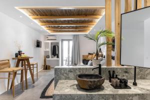 a living room with a large stone sink in the middle at Naxos Anamnisi in Plaka