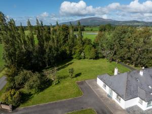 an aerial view of a house with a yard at Ballyneill Farmhouse in Carrick-on-Suir