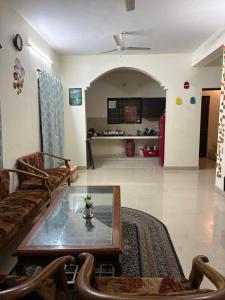 a living room with a couch and a table at Namya Villas in Bhīm Tāl +42 photos