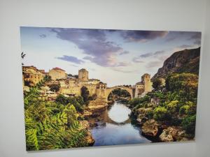 a painting of a bridge over a river at Ulven Paradise in Oslo +12 photos