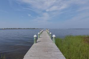 a wooden pier sticking out over a body of water at C103A - Sweet Sound Memories in Nags Head