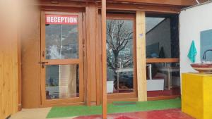 a store front with a rejection sign on the door at Charming Lake View Camp in Bhīm Tāl