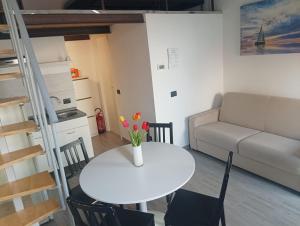a living room with a white table and a couch at Casa Maria - next Milano,Como, Varese in Caronno Pertusella