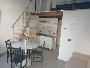 a kitchen and dining room with a table and chairs at Casa Maria - next Milano,Como, Varese in Caronno Pertusella