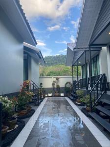 a courtyard of a house with potted plants at Adira Residence in Ao Nang Beach