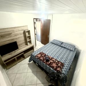 a room with a bed and a flat screen tv at Blue 52 in Torres