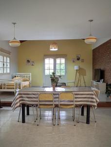 a dining room with a table and chairs at Roque 4047 in San Juan