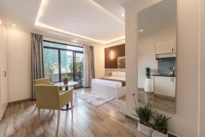 a bedroom with a bed and a table in a room at Liyu Hotel Apartment in Addis Ababa +55 photos