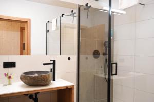 a bathroom with a sink and a shower at Urlaub im Denkmal in Gröbming +39 photos