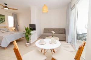 a living room with a bed and a table at 3 Bedroom Villa in Estrella in Dominica