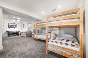a bedroom with two bunk beds and a pool table at Cozy Orem House - Playground - Game Rm - Bunk Rm in Orem