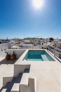 a swimming pool on the roof of a building at Casa Sala - Private Rooftop Swiming Pool in Olhão