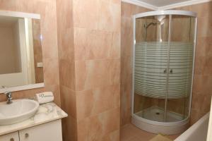 a bathroom with a shower and a sink at Aspen - Duplex 1-BR in Faraya in Fārayyā +33 photos