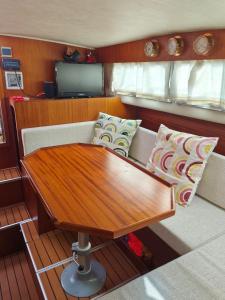 a wooden table sitting on the back of a boat at Jeddah in Izola