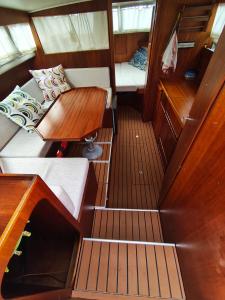 a small room with a bed and a table on a boat at Jeddah in Izola +4 photos