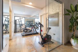 a gym with two exercise bikes in a room at Liyu Hotel Apartment in Addis Ababa