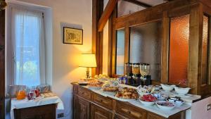 a kitchen with a counter with food on it at Bellavista in Badia Prataglia +39 photos