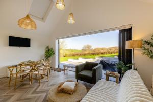 a living room with a couch and a table at 1 Bed in Llanmorlais oc-p35002 in Penclawdd