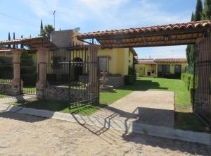 a gate in front of a house at Rincones de Tequis in La Tortuga