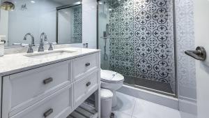 a white bathroom with a shower and a toilet at THE TIDES 2bedrooms apt 14th floor WE ARE ON THE BEACH! in Hollywood