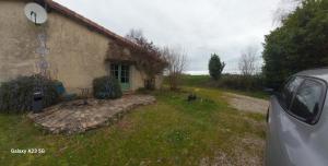 a car parked in front of a house at Studio cosy au calme in Chillac