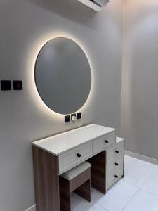a bathroom with a vanity with a mirror on the wall at دار مسك الفندقية in Medina