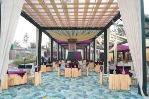 a group of tables and chairs in a pavilion at pearl green's in Anandpur Sāhib