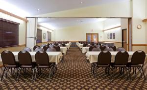 a room with rows of tables and chairs in it at AmericInn by Wyndham Fergus Falls Conference Center in Fergus Falls +43 photos