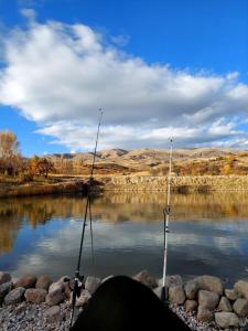 a couple of fishing poles in the water at Garnu Maran in Garni