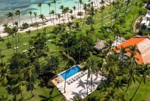 an aerial view of a resort with a swimming pool and a beach at Wyndham Alltra Samana All Inclusive Resort in Las Galeras +226 photos
