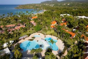 an aerial view of a resort with a pool at Wyndham Alltra Samana All Inclusive Resort in Las Galeras