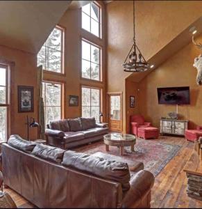a large living room with a couch and a table at The Great Escape in Lead