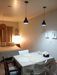 a room with a bed and a table and chairs at LIVe in Villa Elisa