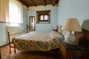 A bed or beds in a room at Il Nido - Private villa with pool and jacuzzi