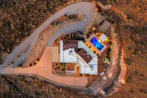 an overhead view of a house with a swimming pool at Secluded Retreat Pool Spa Sauna Rooftop Deck in Las Cruces