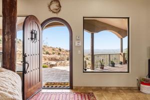 an open door with a view of a patio at Secluded Retreat Pool Spa Sauna Rooftop Deck in Las Cruces