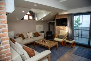 a living room with a couch and a table at Sofia Beach Residence in Trabzon