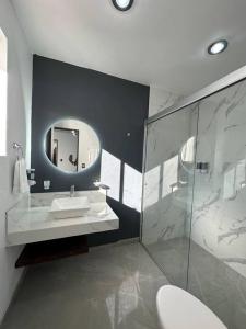 a bathroom with a sink and a mirror at AR SUITES Casa Luneta in Zamora de Hidalgo +23 photos