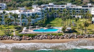 an aerial view of a resort with a beach at Sea Winds Cabarete in Cabarete