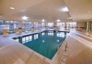 a large swimming pool in a hotel room at Fairfield Inn & Suites by Marriott Wausau in Weston