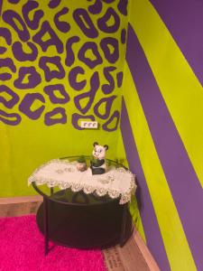 a room with a table with a toy mouse on it at Diana Apartments in Klingenthal +28 photos