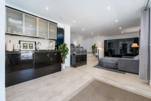 a living room with a couch and a table at Casa Lorna in Marbella